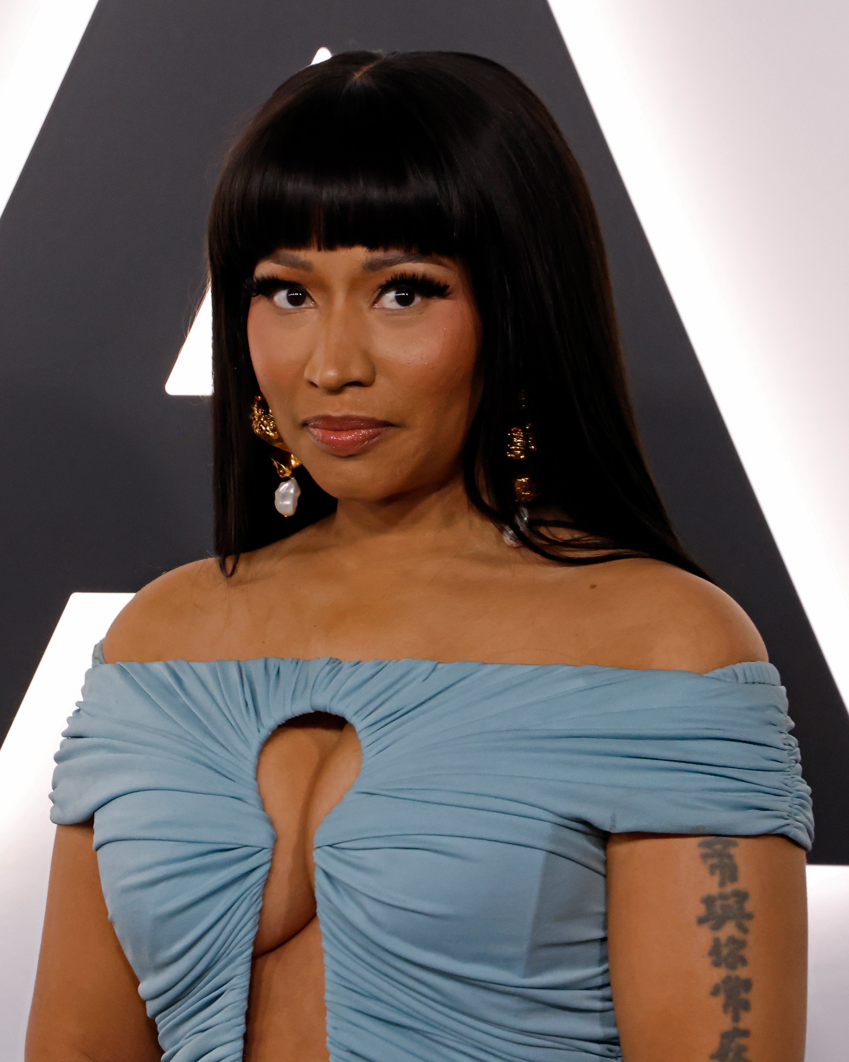 Nicki Minaj successful off-the-shoulder formal with keyhole cutout posing astatine a ceremonial event