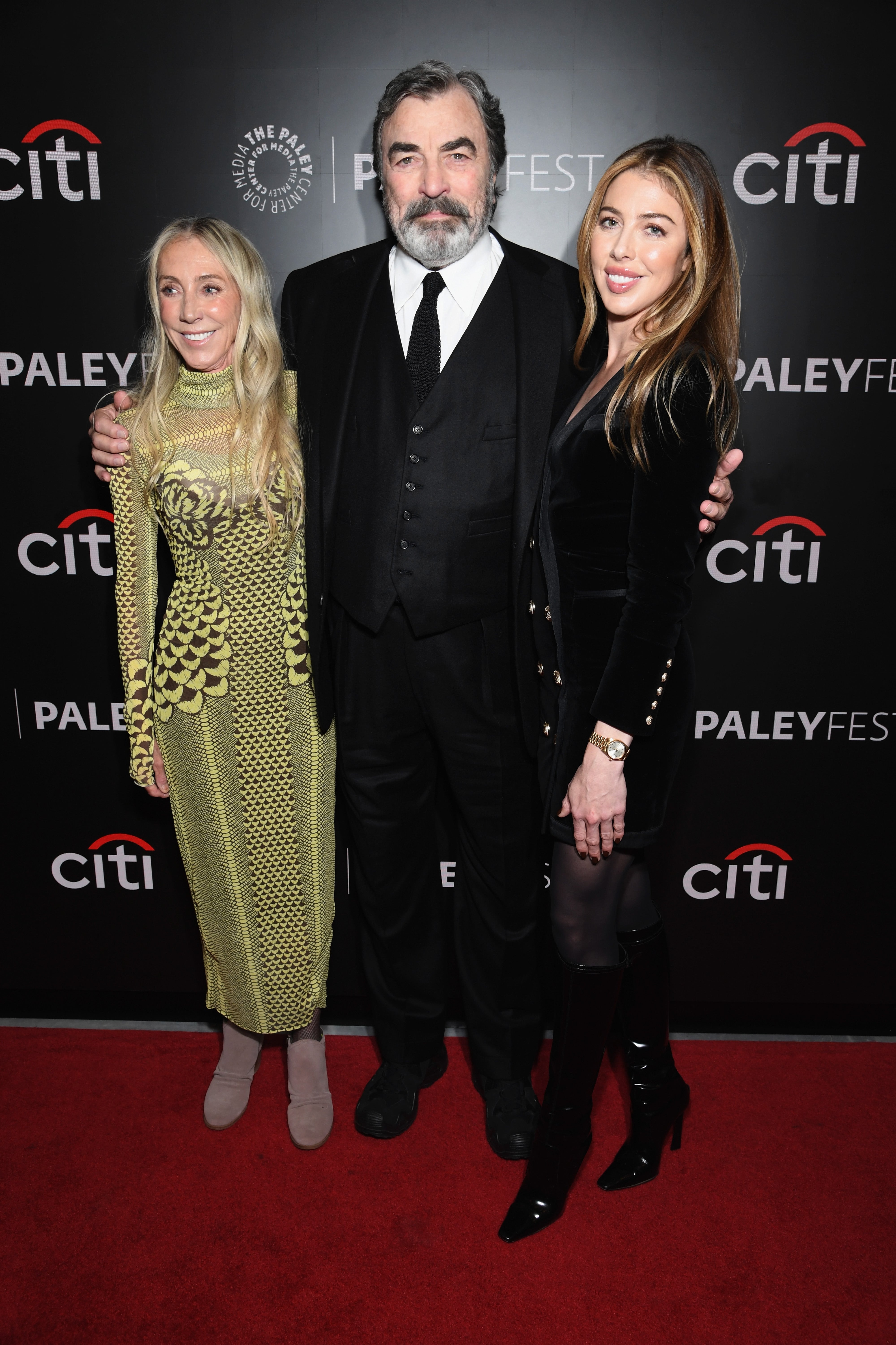 Three radical   airs  connected  a reddish  carpet astatine  PaleyFest. The antheral   wears a suit, 1  pistillate   wears a patterned dress, and the different   is successful  a velvet outfit