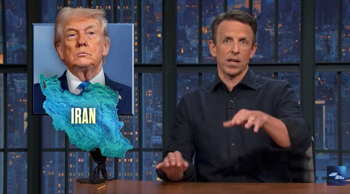 TV big   Seth Meyers gestures portion    seated by an representation  of Iran overlaid with Donald Trump's face