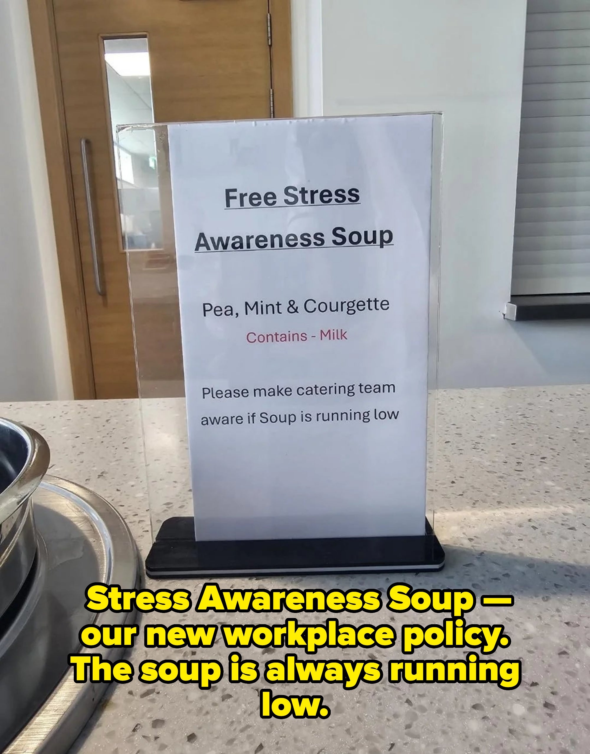 Sign reads: Free Stress Awareness Soup. Pea, Mint &amp;amp; Courgette. Contains milk. Inform catering if soup is running low