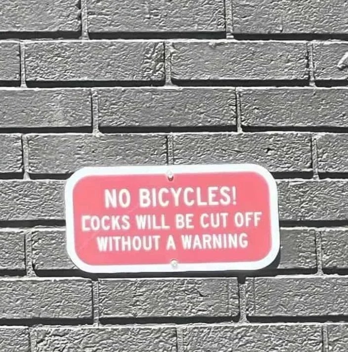 Sign on a brick wall reads: "No bicycles! Locks will be cut off without a warning."