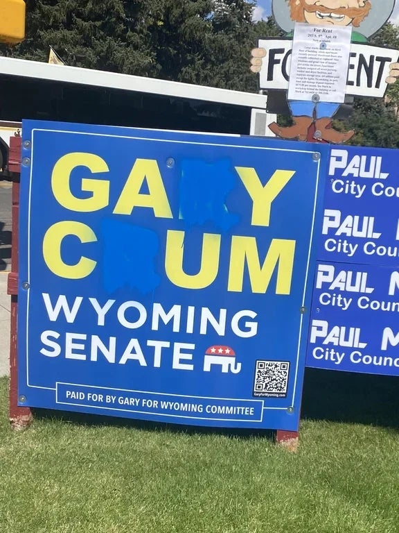Campaign sign for Gary Crum, running for Wyoming Senate, with a QR code and note about campaign funding