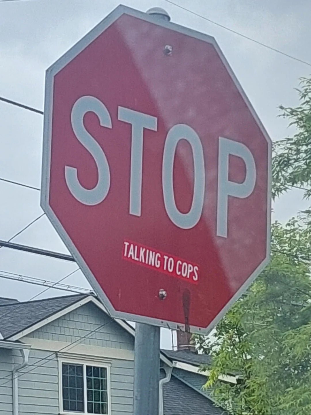Stop sign edited to include "Talking to Cops" below the word "STOP."