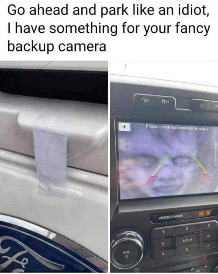 Car with tape on camera disrupts backup view; message pokes fun at careless parking
