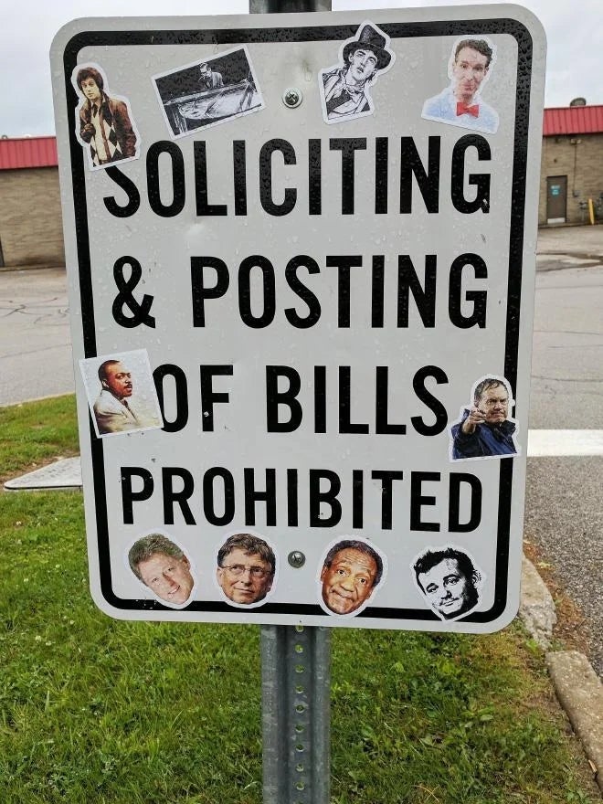 Street sign reads "Soliciting &amp;amp; Posting of Bills Prohibited." Decorated with cut-out images of people named "Bill."
