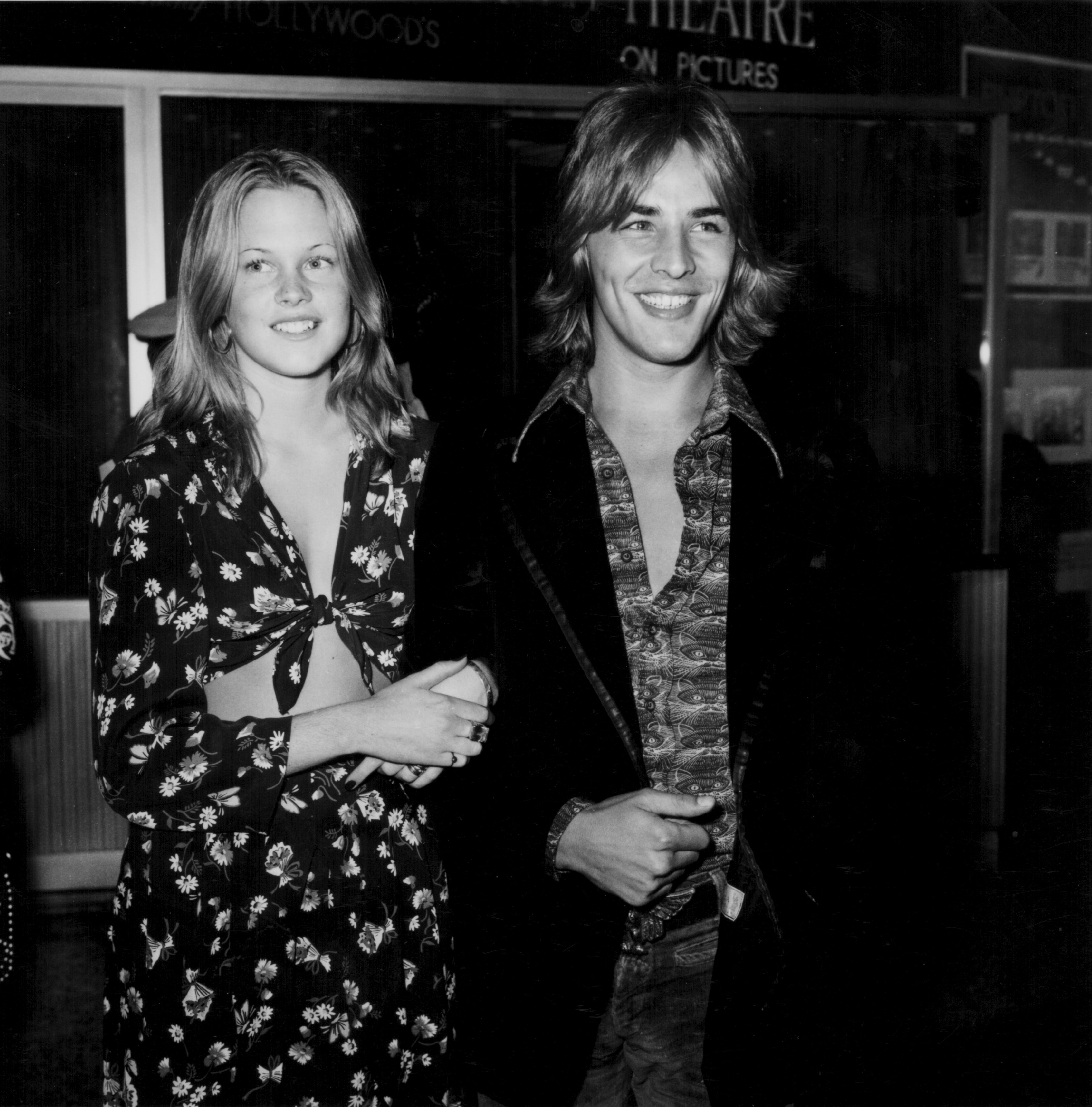 Two radical are smiling astatine an event. The pistillate wears a floral-patterned dress, and the antheral is successful a casual garment and jacket