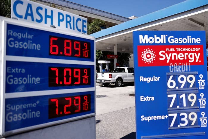 Gas station price signs showing high fuel costs for different gasoline types