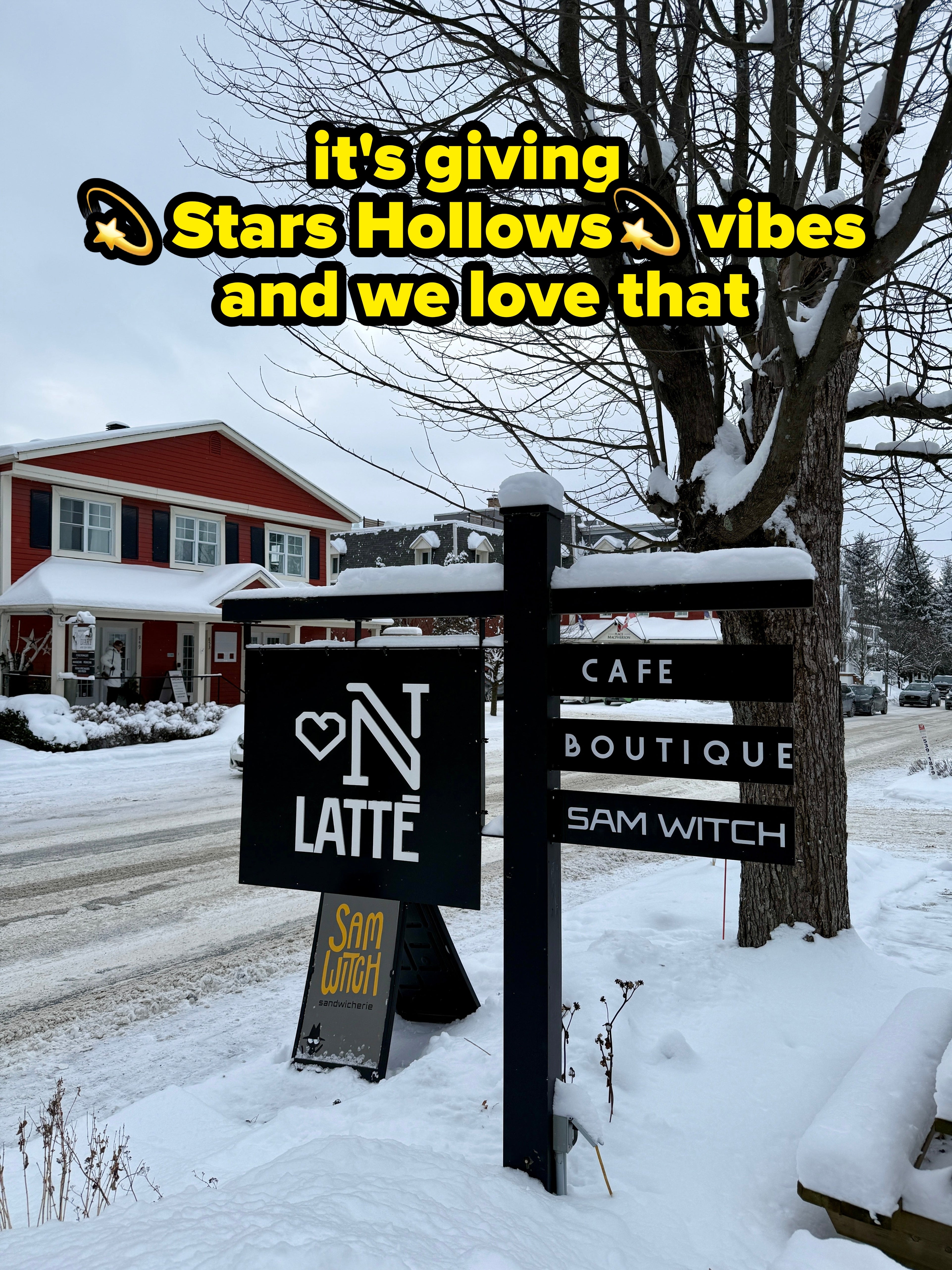 Snowy thoroughfare with a cafe motion speechmaking "ON T LATTÉ, SAM WITCH, CAFE, BOUTIQUE" adjacent to a reddish building, successful a wintertime setting