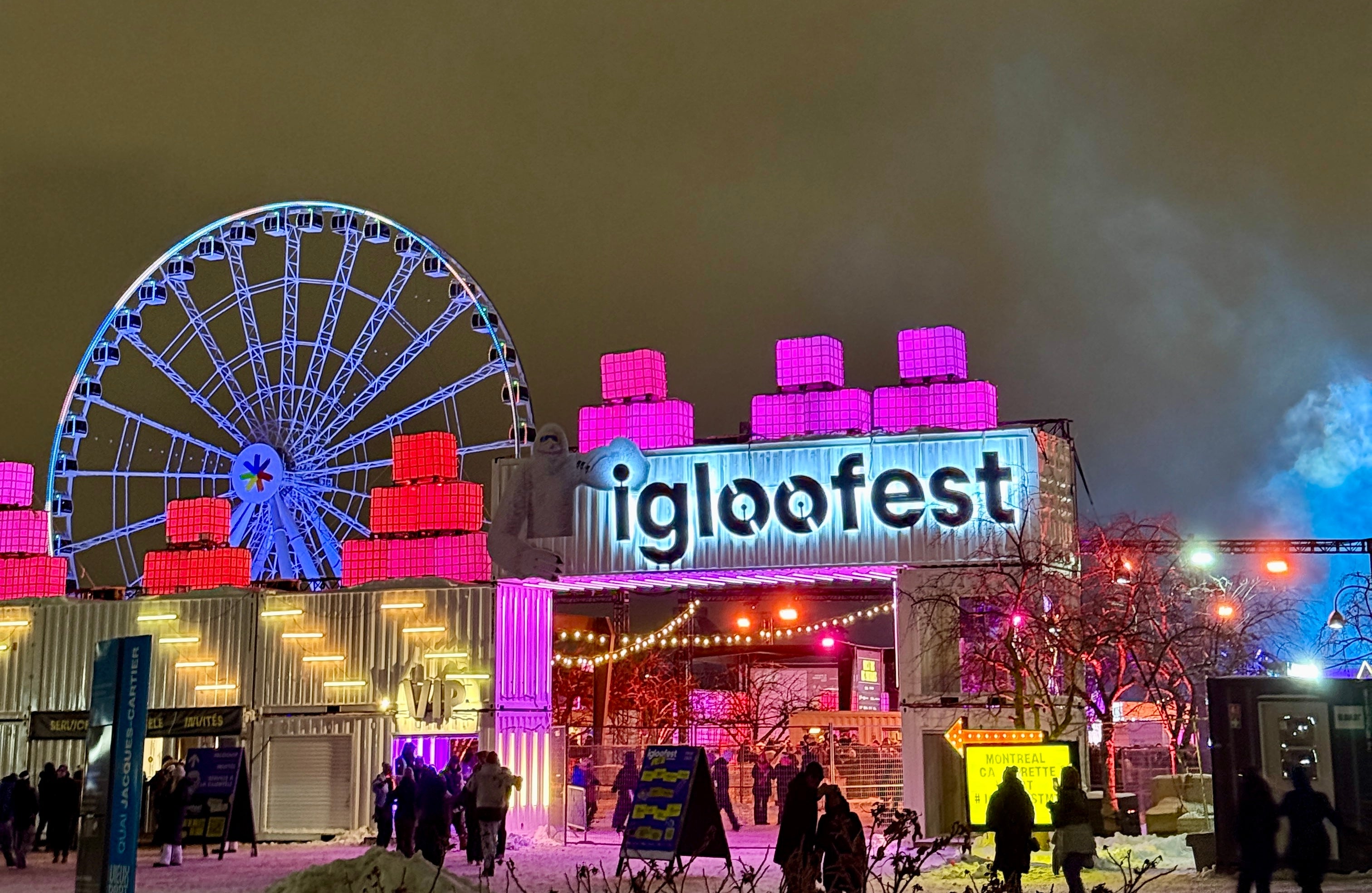 Lit-up Igloofest entranceway with a Ferris instrumentality successful the background, festive lights, and radical enjoying the wintertime lawsuit atmosphere