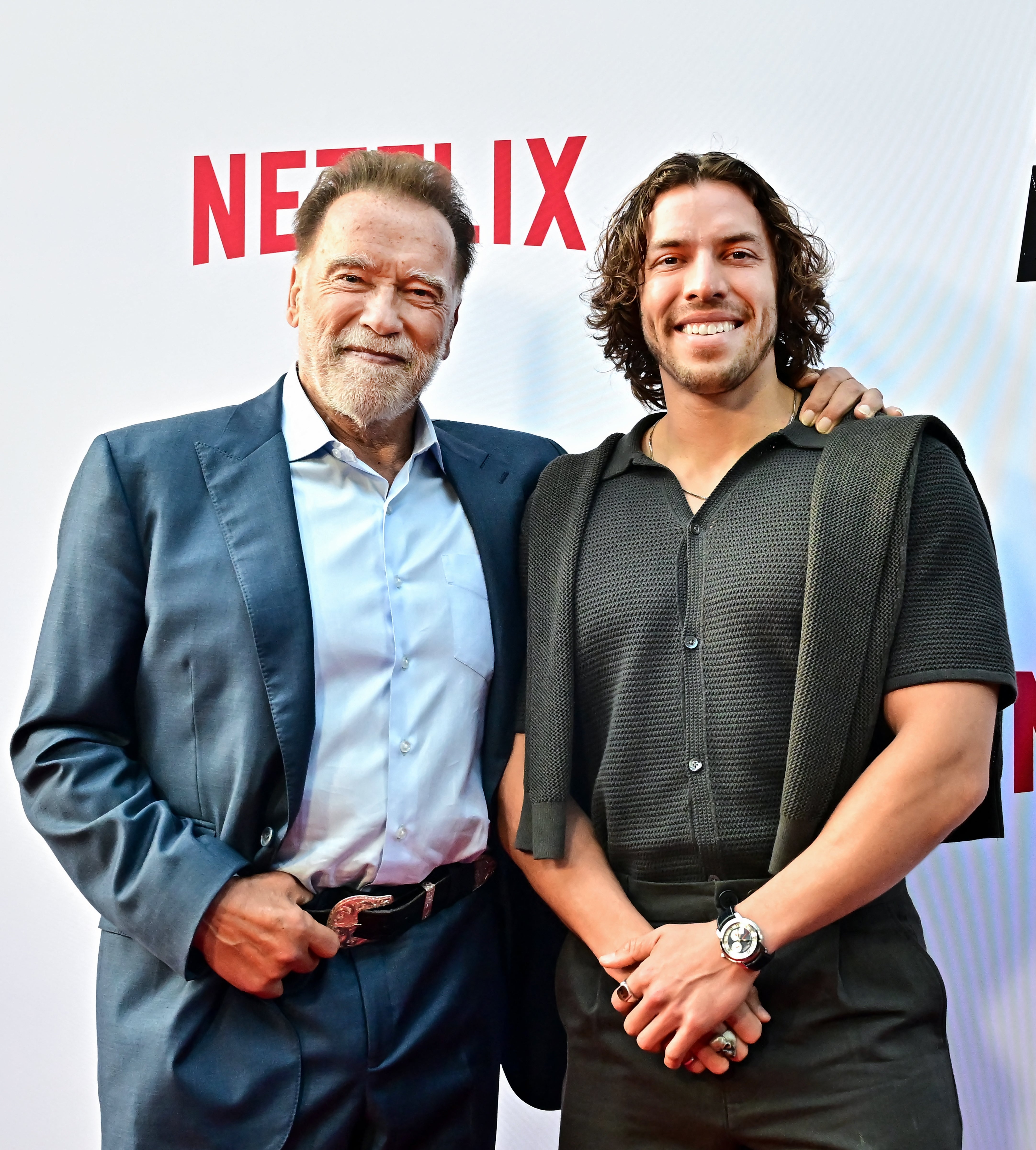 Arnold and lad   Joseph Baena airs  connected  a reddish  carpet