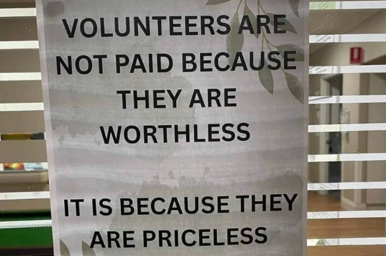 Sign reads: "Volunteers are not paid because they are worthless. It is because they are priceless."