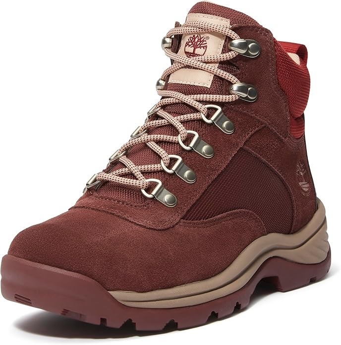 Hiking footwear with durable sole, metallic eyelets, and padded collar, suitable for outdoor activities
