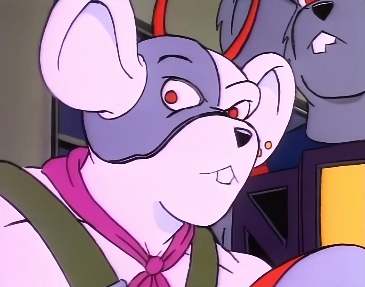 An animated achromatic and grey rodent with a pinkish scarf and an aggravated expression, from a classical cartoon series