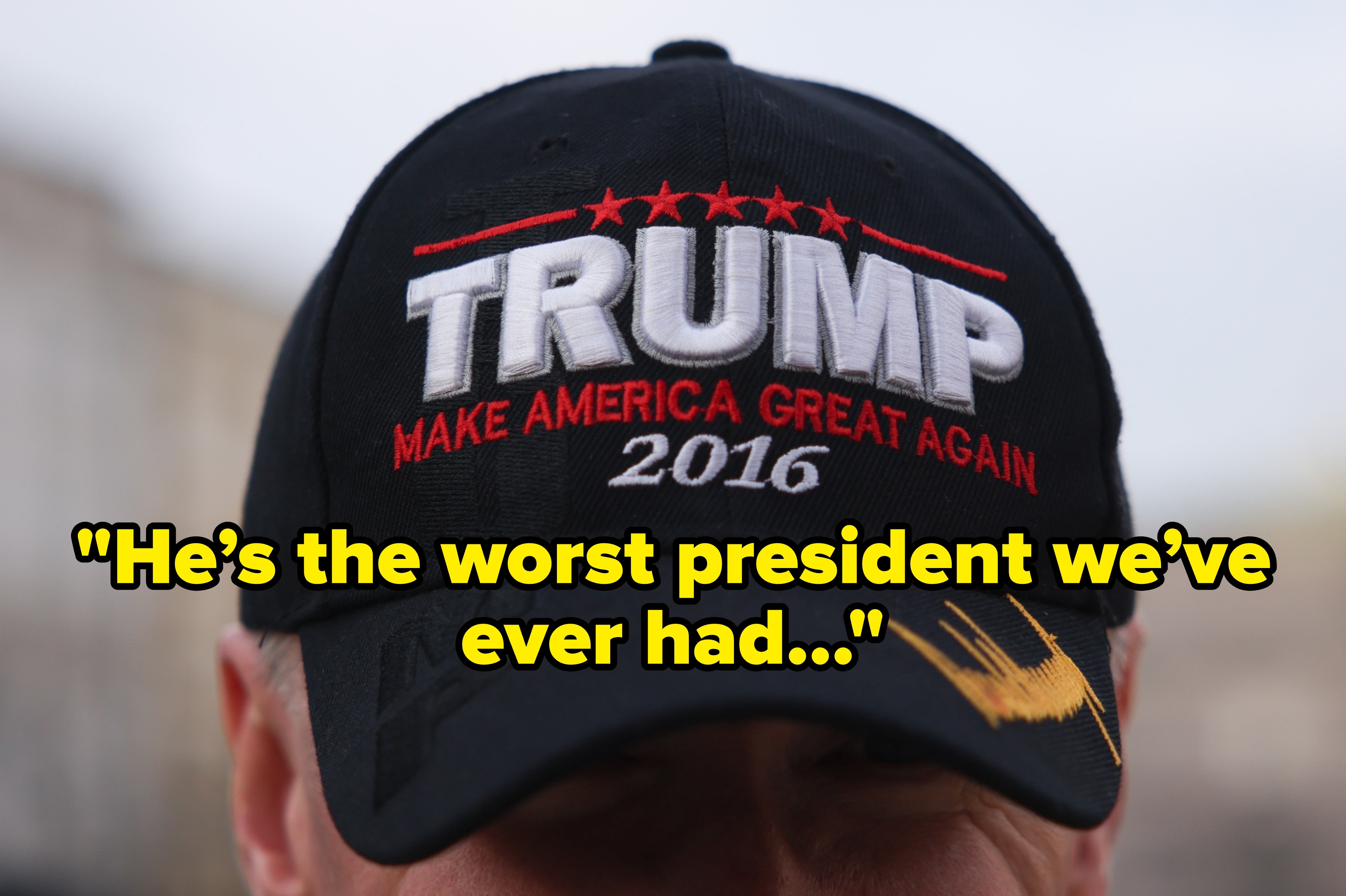 Person wearing a black cap with "TRUMP MAKE AMERICA GREAT AGAIN 2016" embroidered on it