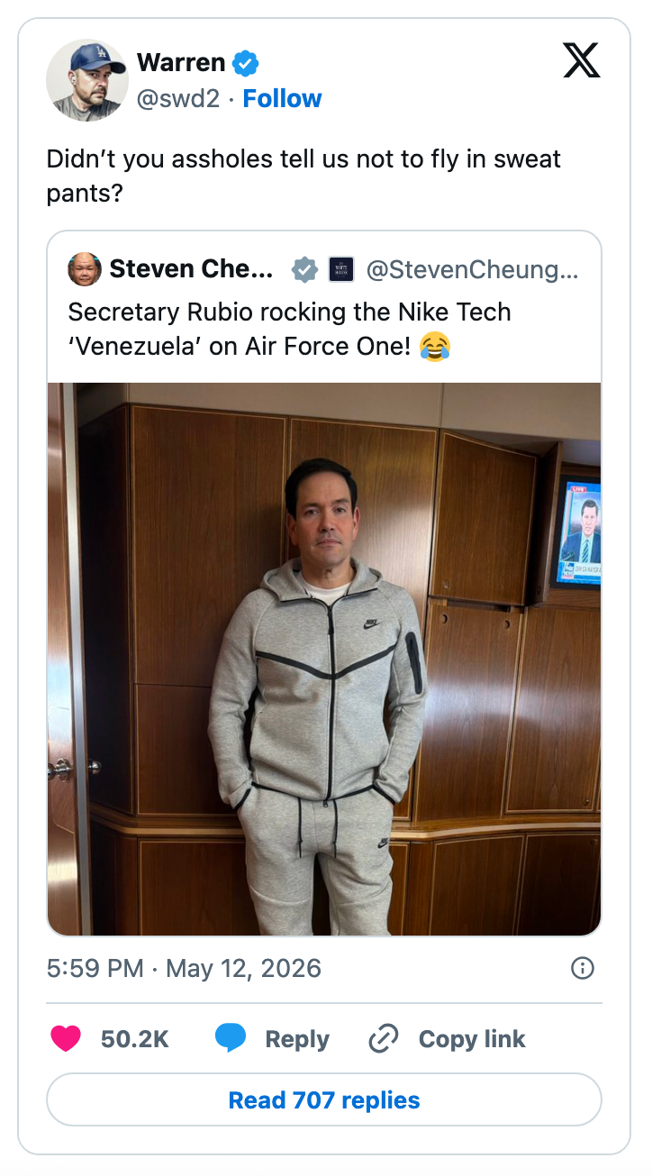 Screenshot of a tweet jokingly criticizing another tweet about a person wearing Nike Tech "Venezuela" sweats on Air Force One