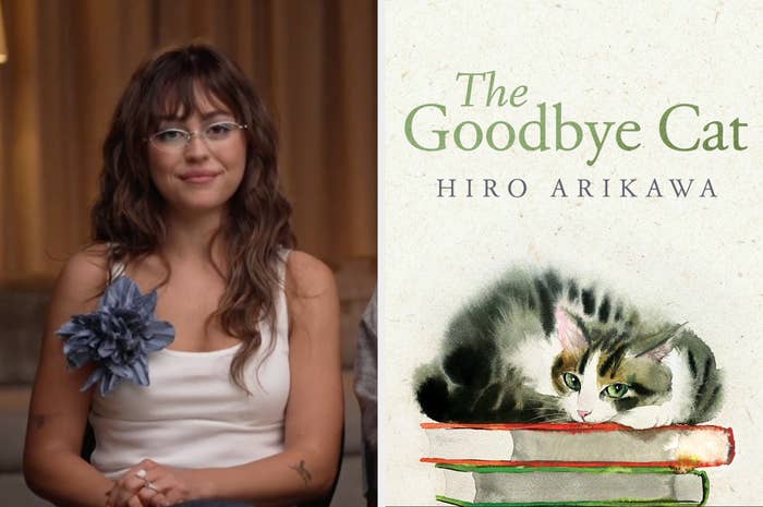 Person seated with glasses and floral accessory next to "The Goodbye Cat" book cover featuring a cat lying on books