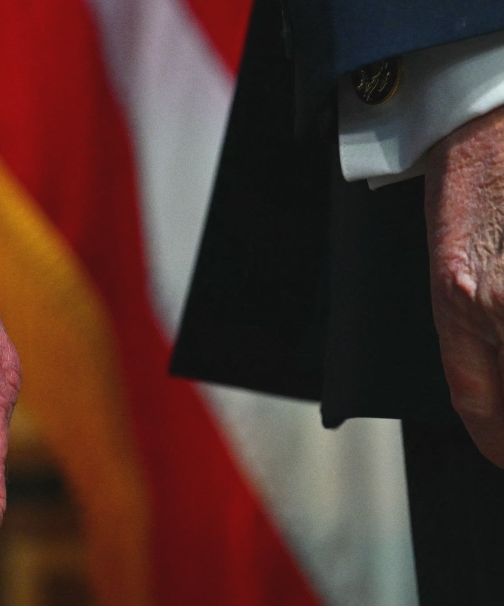 Closer close up of Donald Trump's hand, visibly bruised and covered in makeup