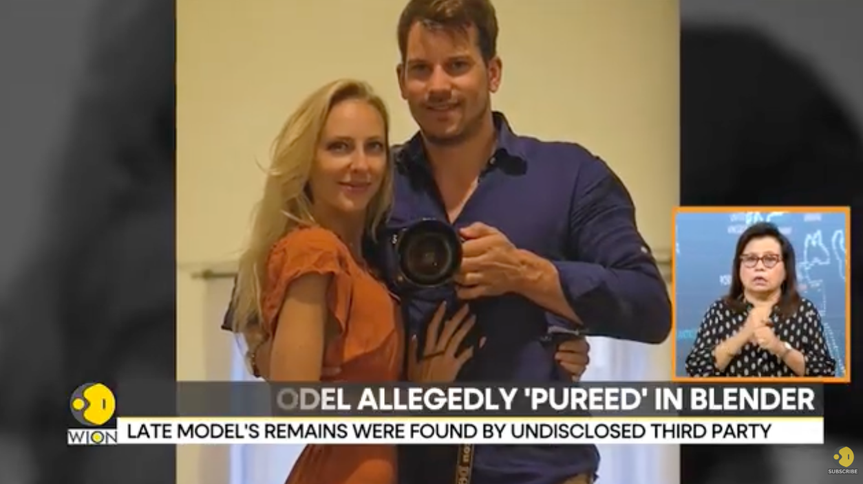 Two people smiling, one holding a camera, with a TV graphic and text about a crime involving a model in a blender