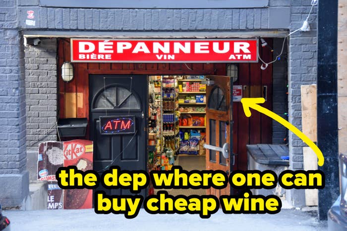 Storefront of a dépanneur with an unfastened  door, revealing shelves of goods inside. Signs item   beer, wine, and ATM services