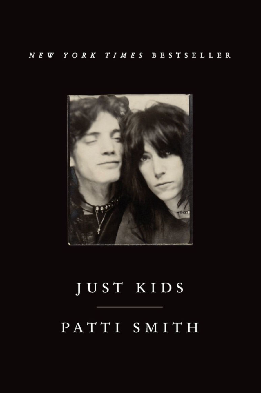 Cover of "Just Kids" by Patti Smith, featuring a black-and-white photo of two people. Book is a New York Times bestseller