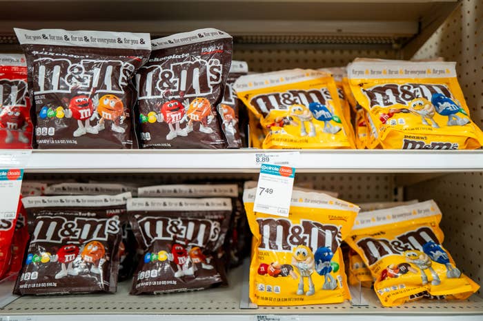M&amp;amp;M's chocolate and peanut candies displayed on a store shelf, with price tags visible