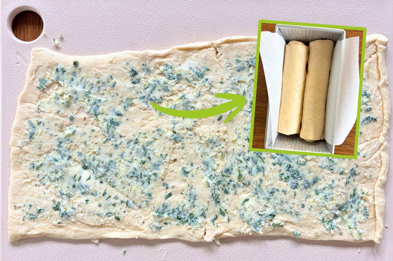 Dough spread with garlic-herb butter, showing a rolled version ready for baking
