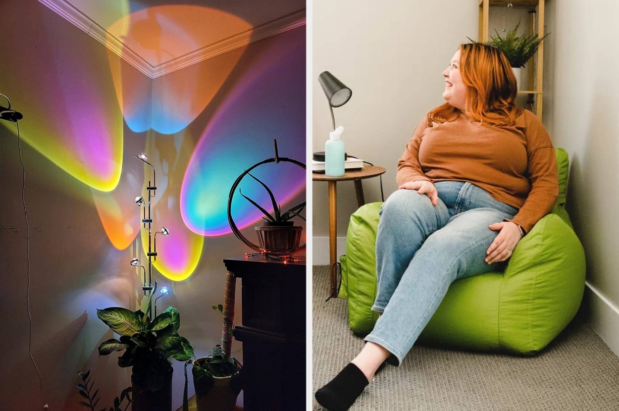 Room with modern lighting display and plants; woman in casual sweater and jeans sitting on a green beanbag, looking at the display