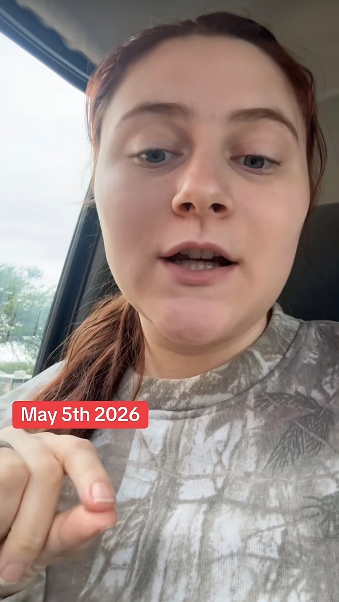 Young person speaking in a vehicle, wearing a patterned top. Text overlay reads: "May 5th 2026."