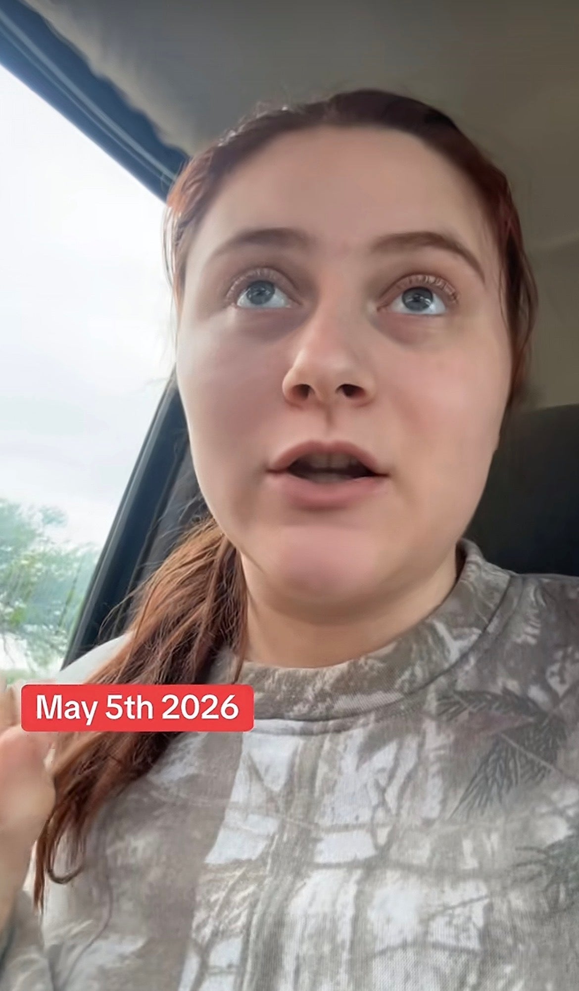 Person in a car speaking, with text overlay "May 5th 2026."
