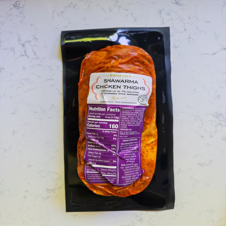 Packaged shawarma chicken thighs with nutritional information label visible