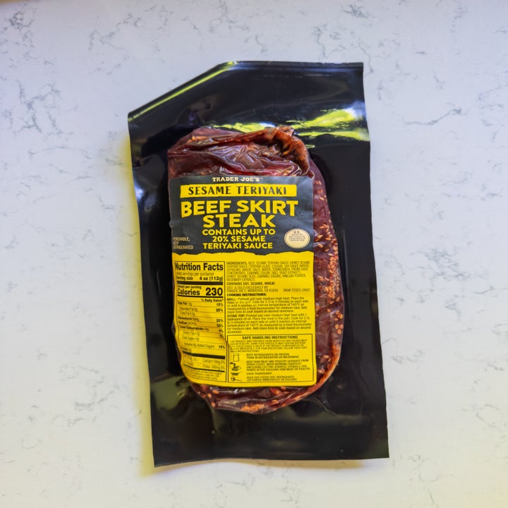 Package of Trader Joe's sesame teriyaki beef skirt steak on a light surface. Includes nutrition facts and ingredients on the label
