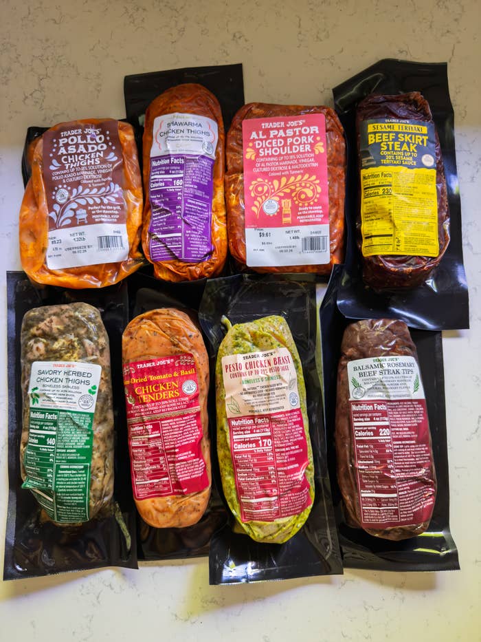 Various packaged Trader Joe's vacuum-sealed meat products on display