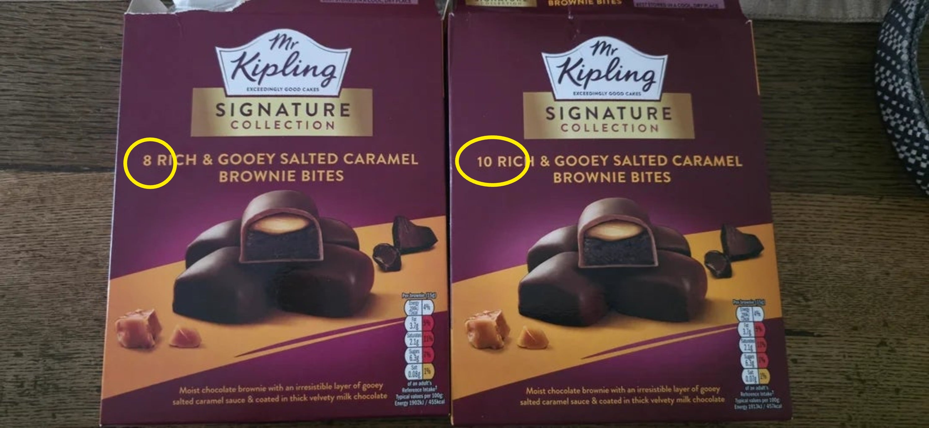 Two boxes of Mr Kipling Signature Collection affluent  and gooey salted caramel brownie bites connected  a table