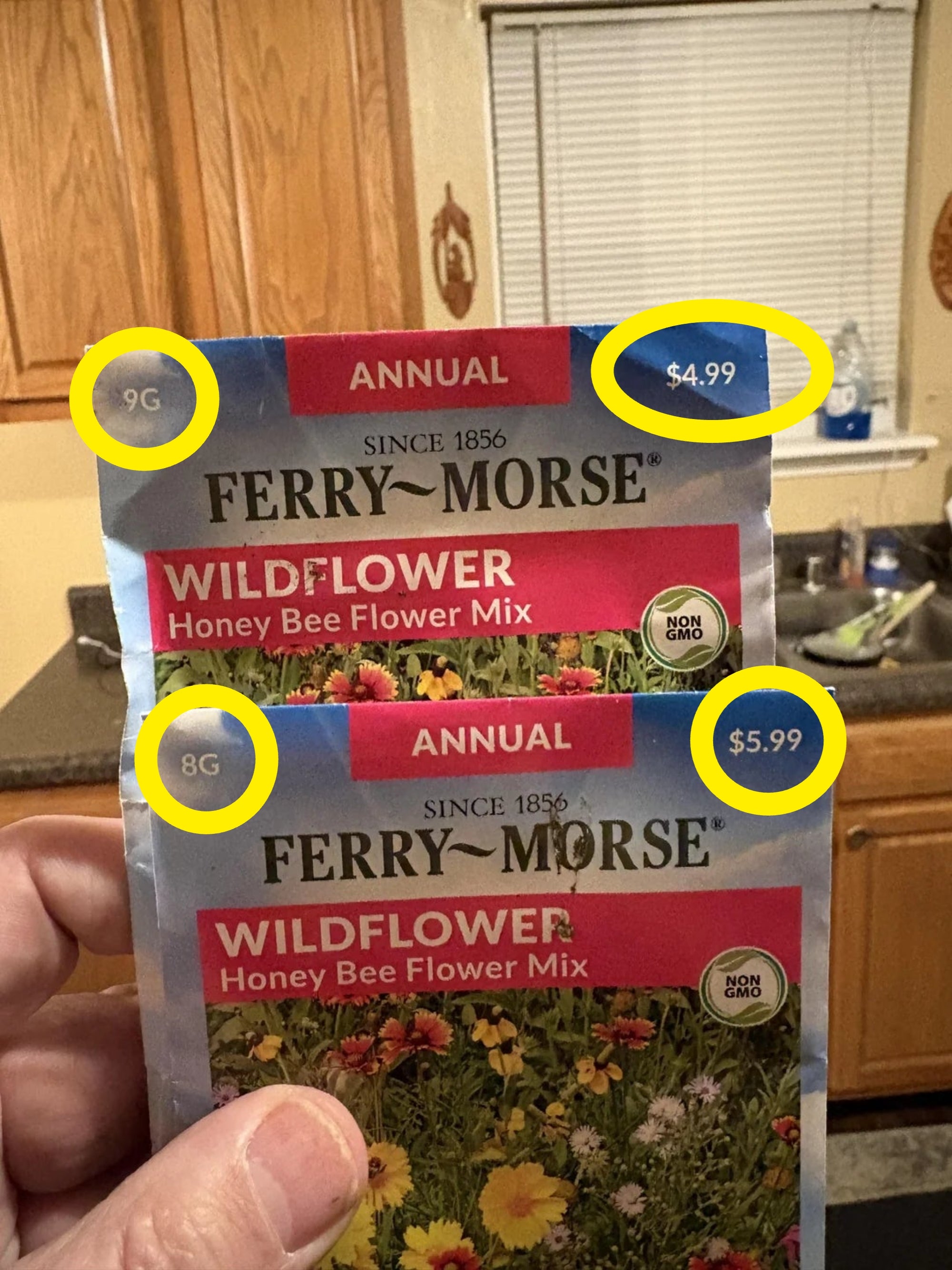 Two packets of Ferry-Morse wildflower chromatic  bee angiosperm  premix  seeds held successful  a kitchen