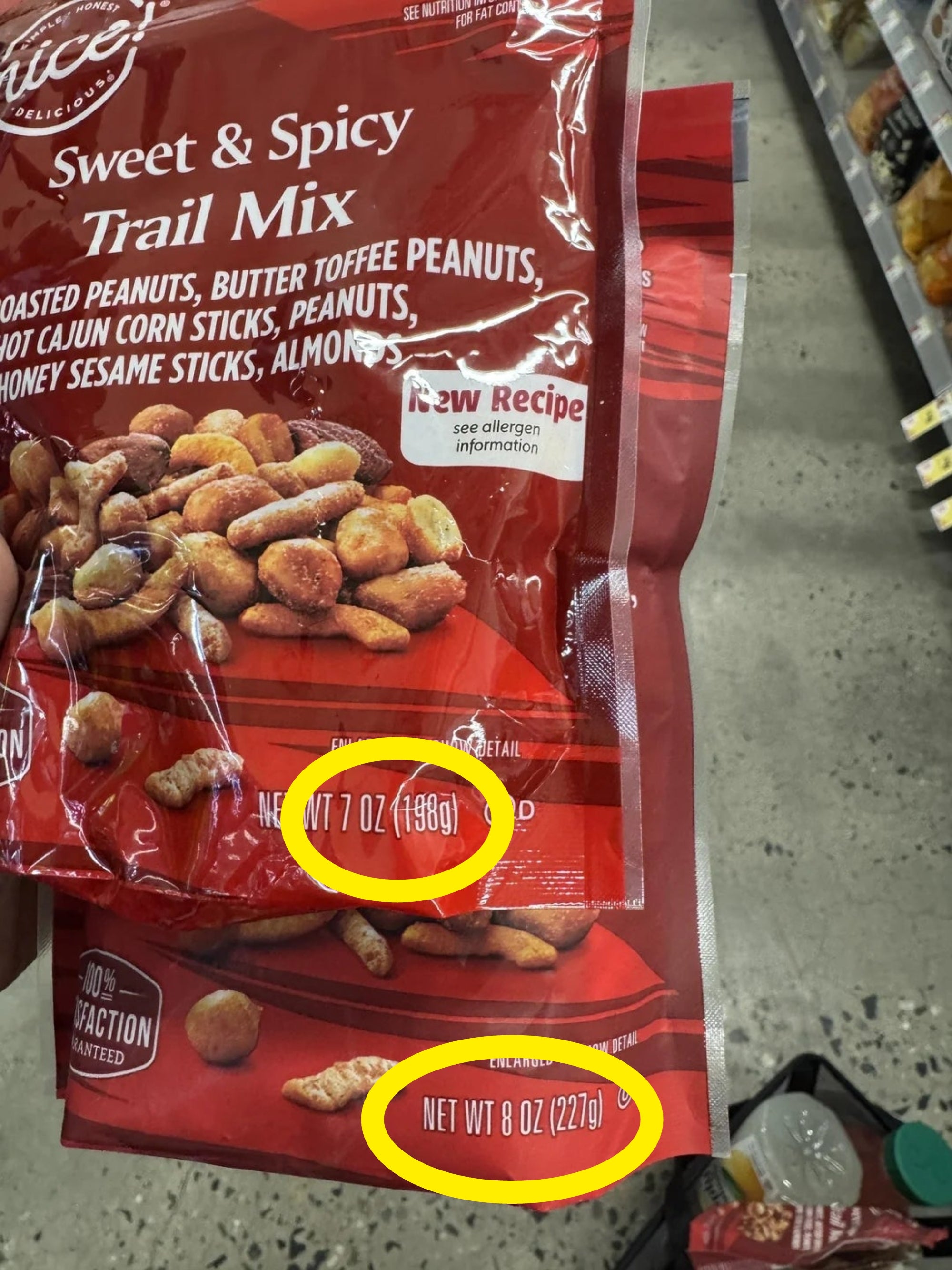 Bag of saccharine  and spicy way   premix  with peanuts, maize  sticks, and almonds successful  a store   aisle