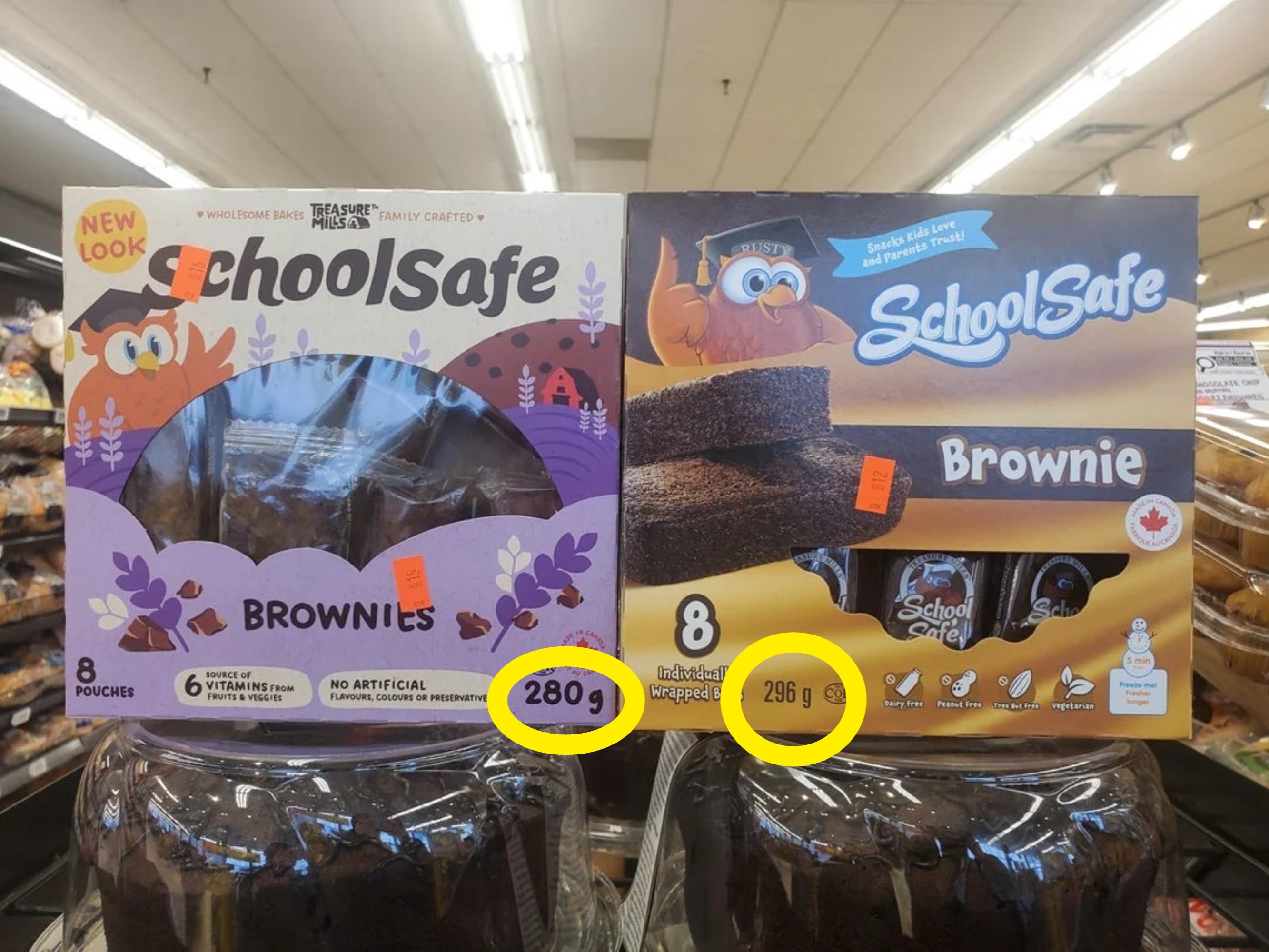 Two boxes of School Safe brownies connected  a store   shelf, 1  with caller   packaging and 1  with older packaging