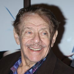 Jerry Stiller in a suit smiling