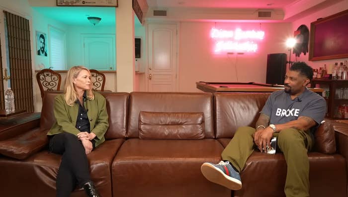 Two radical   beryllium   connected  a brownish  leather sofa  successful  a casual interrogation  setting. A neon motion   glows connected  the wall, creating a relaxed atmosphere