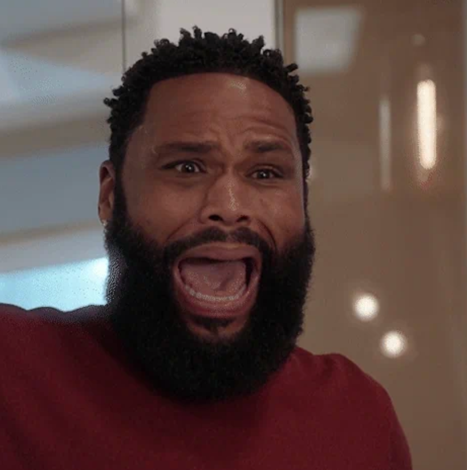 A person looking shocked or surprised, with a wide-open mouth and eyes