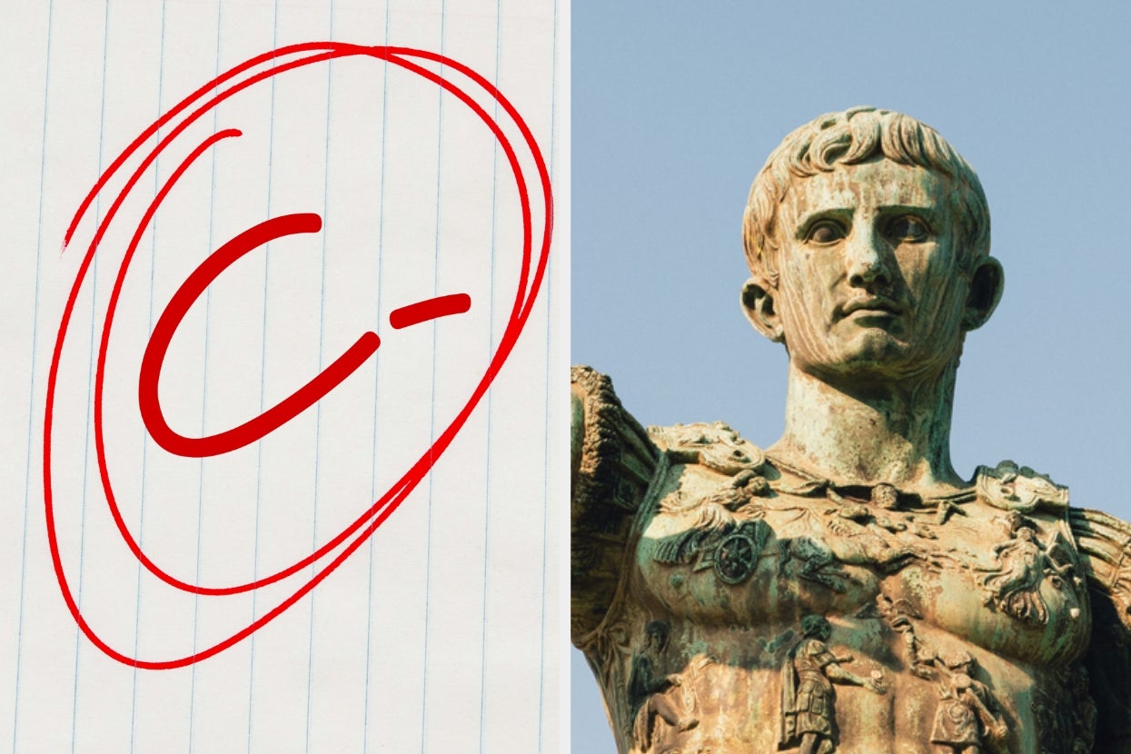 C- grade written on paper; alongside is a Roman statue of a Julius Cesear in armor