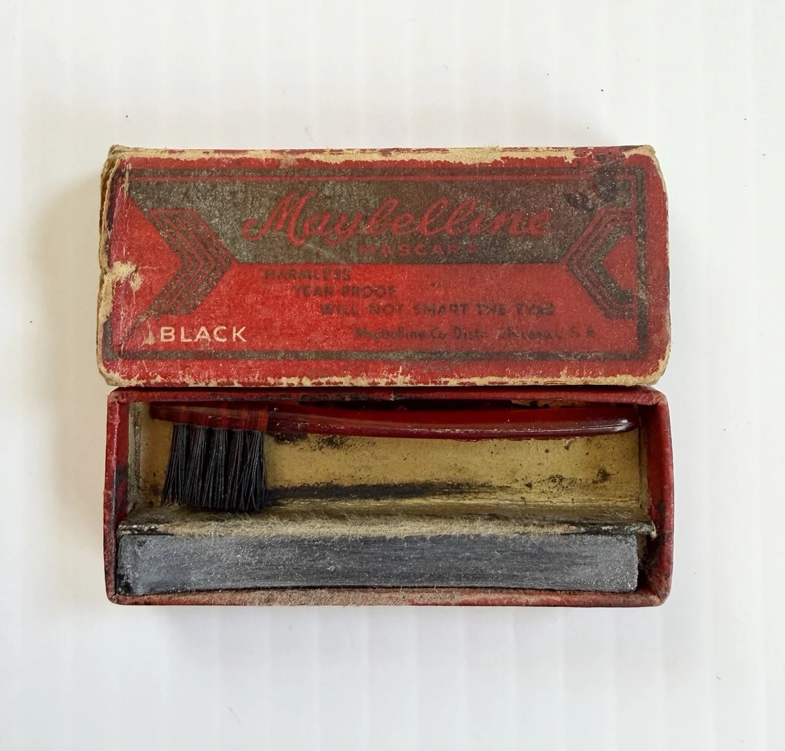 Vintage Maybelline mascara set with brush and block, circa early 20th century, showing retro packaging design