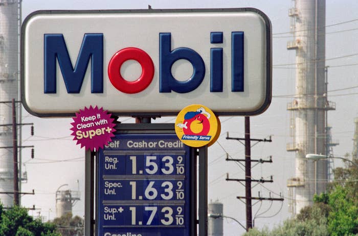 Mobil gas station sign showing fuel prices: Regular $1.53, Special $1.63, Super $1.73. Includes "Keep it Clean with Super+" and Friendly Serve logos