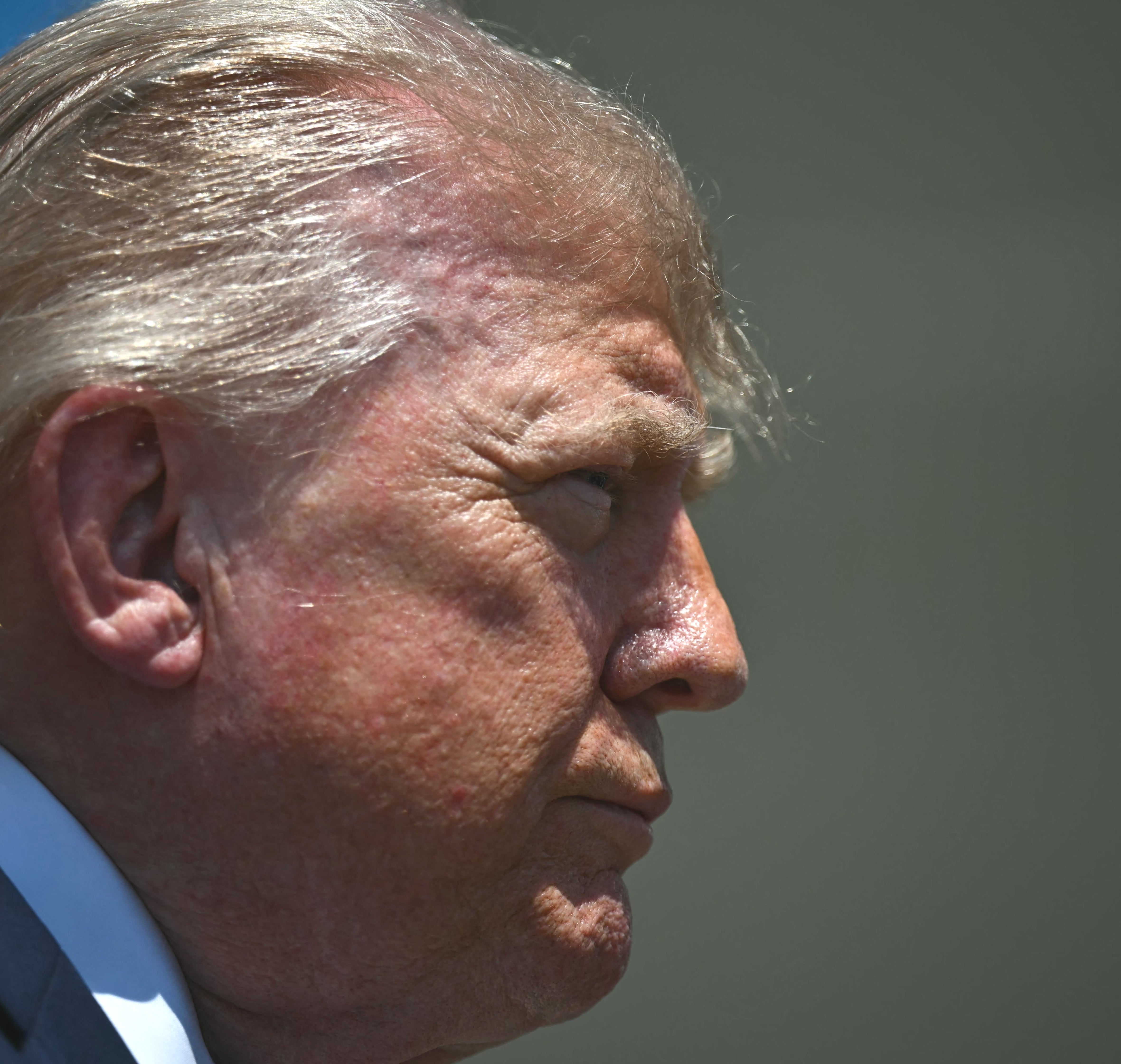 Close-up of Donald Trump in profile, hair is messy