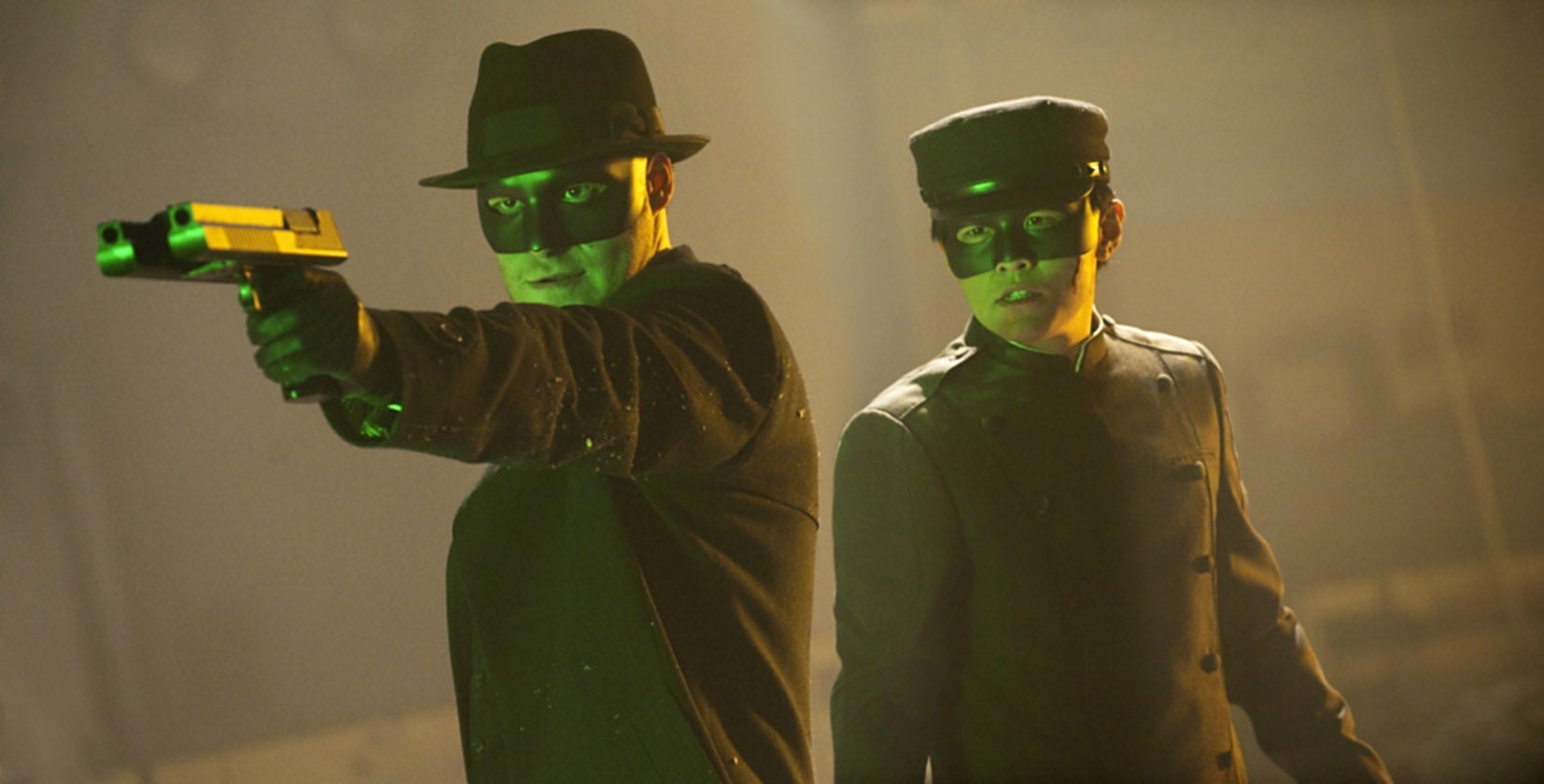 Two individuals successful  masks, 1  aiming a gun, some  wearing hats and acheronian  outfits, giving a mysterious, action-packed vibe