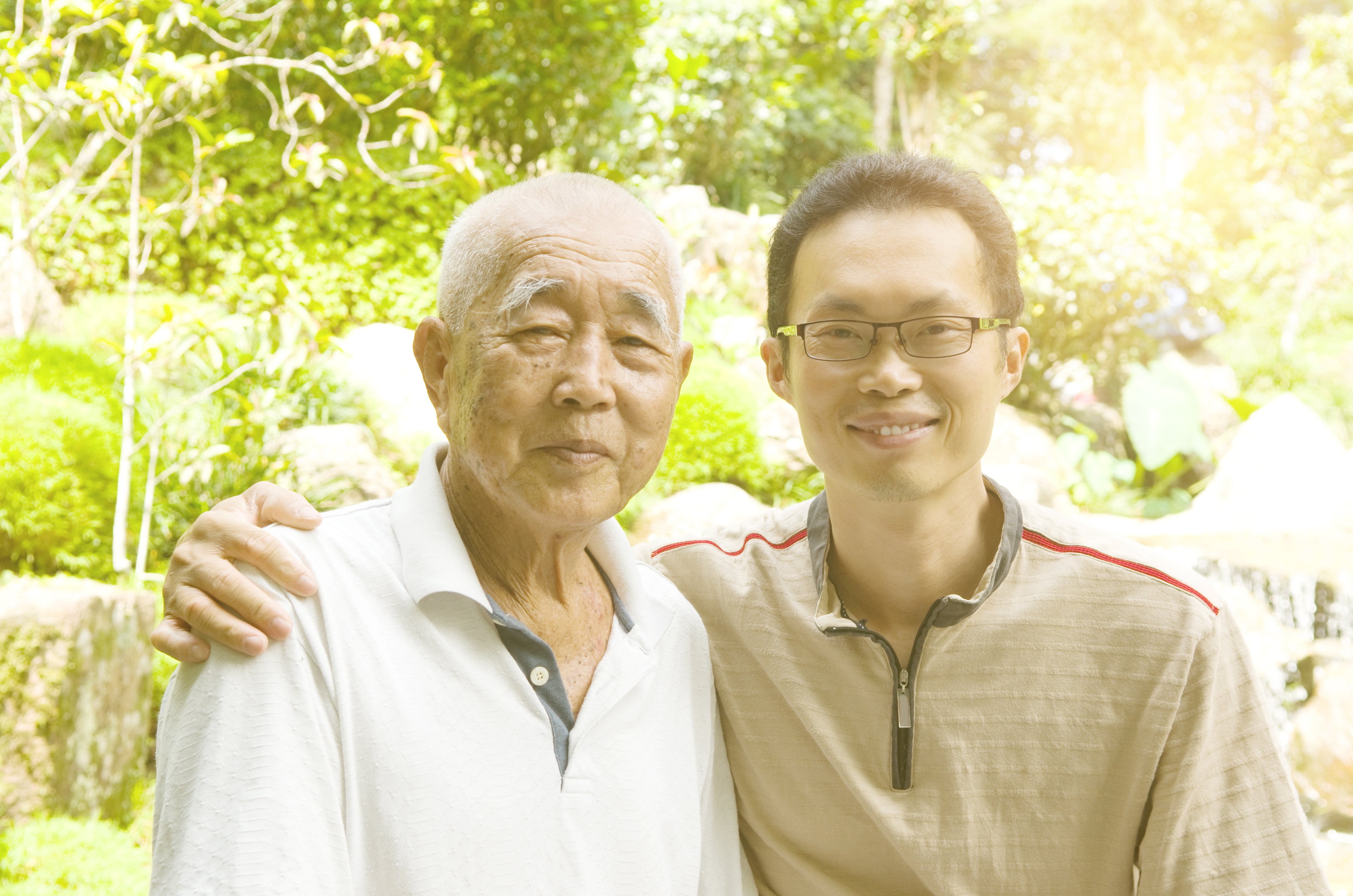 Two men smiling outdoors, suggesting a taxable of wellness and well-being