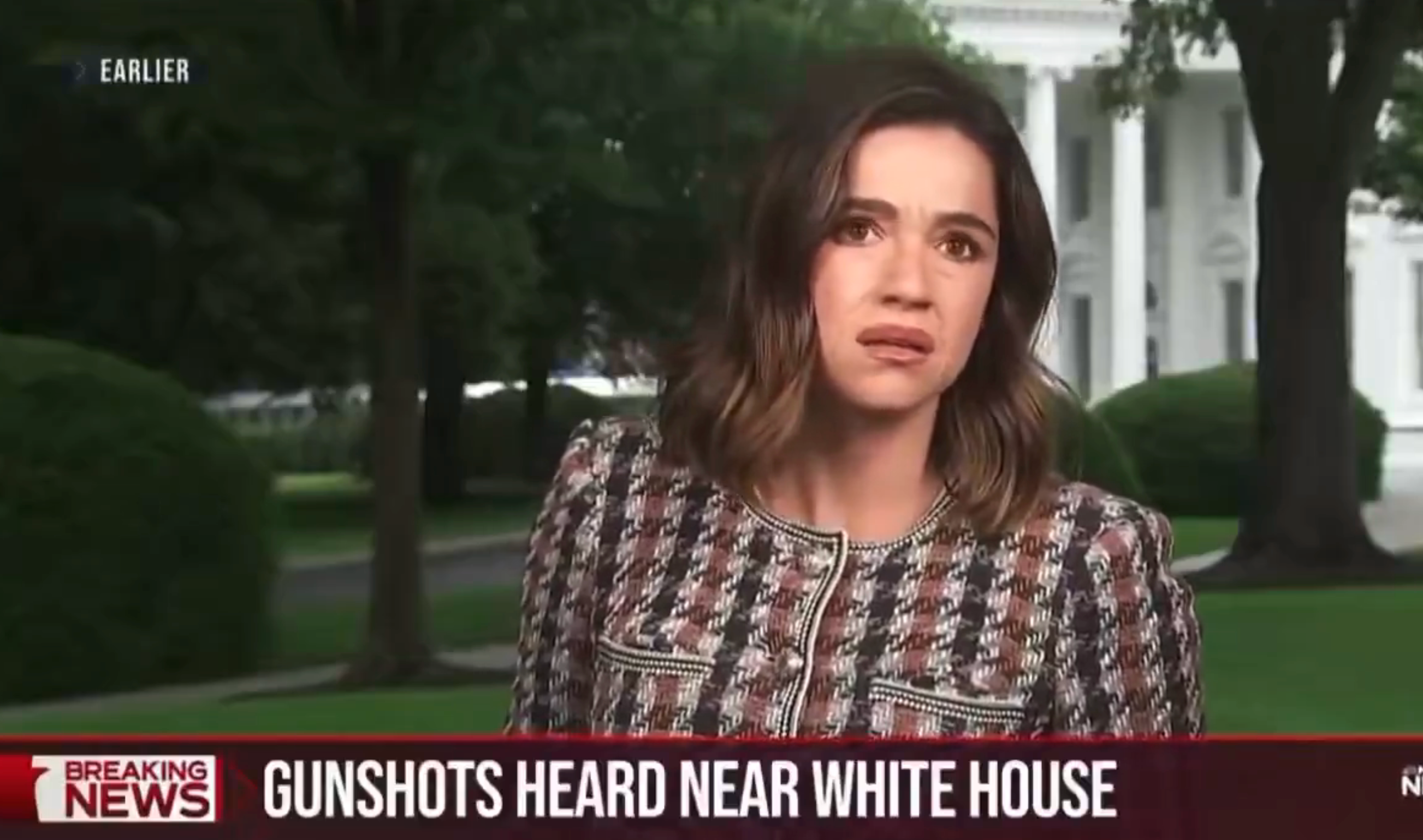 News reporter standing outside the White House, serious expression, with headline: "Gunshots heard near White House."