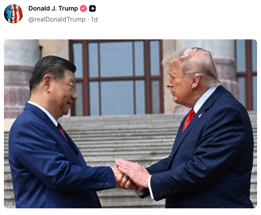 Two men in business suits shaking hands outdoors