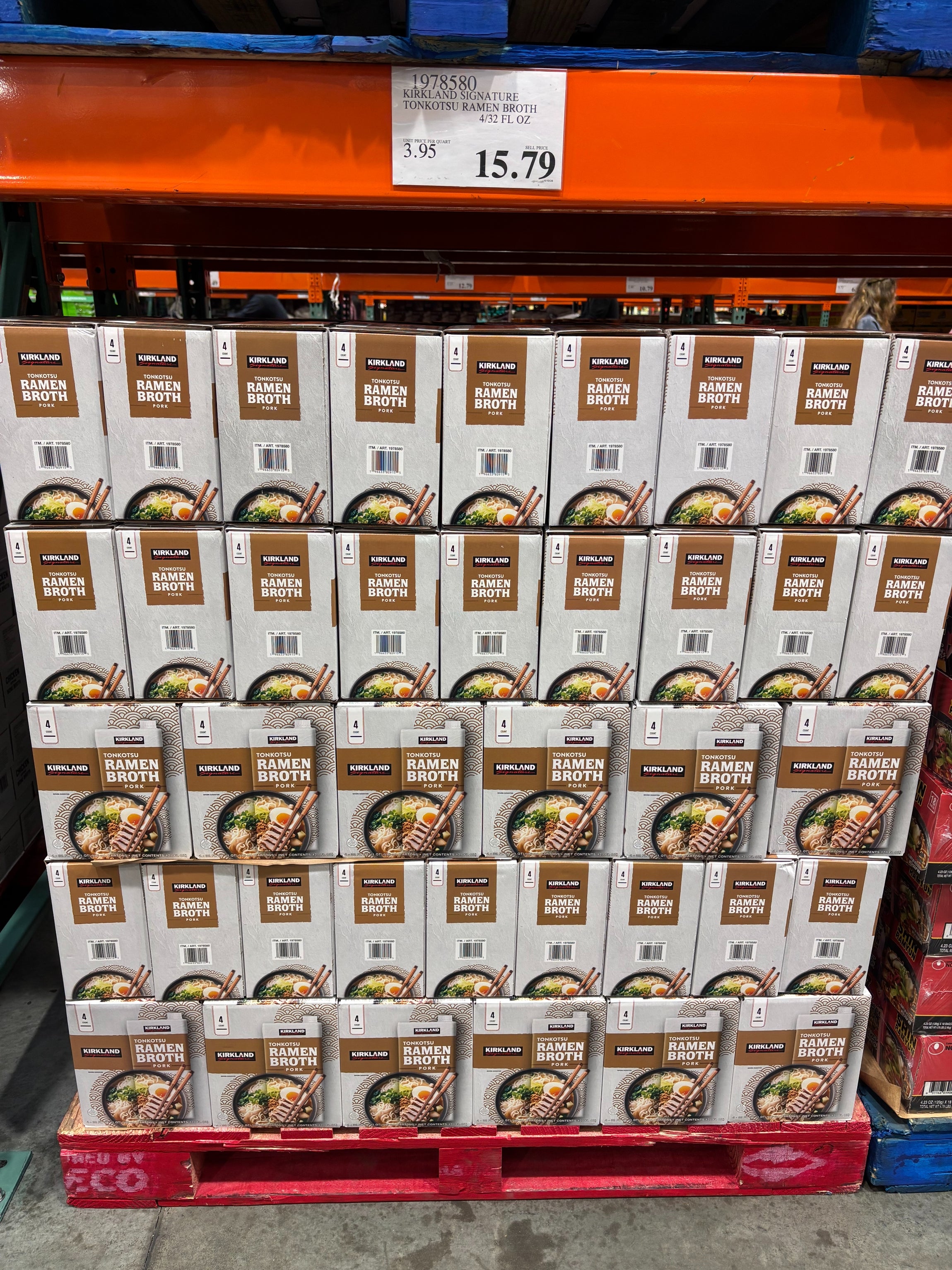 Boxes of ramen broth stacked connected  a store   pallet