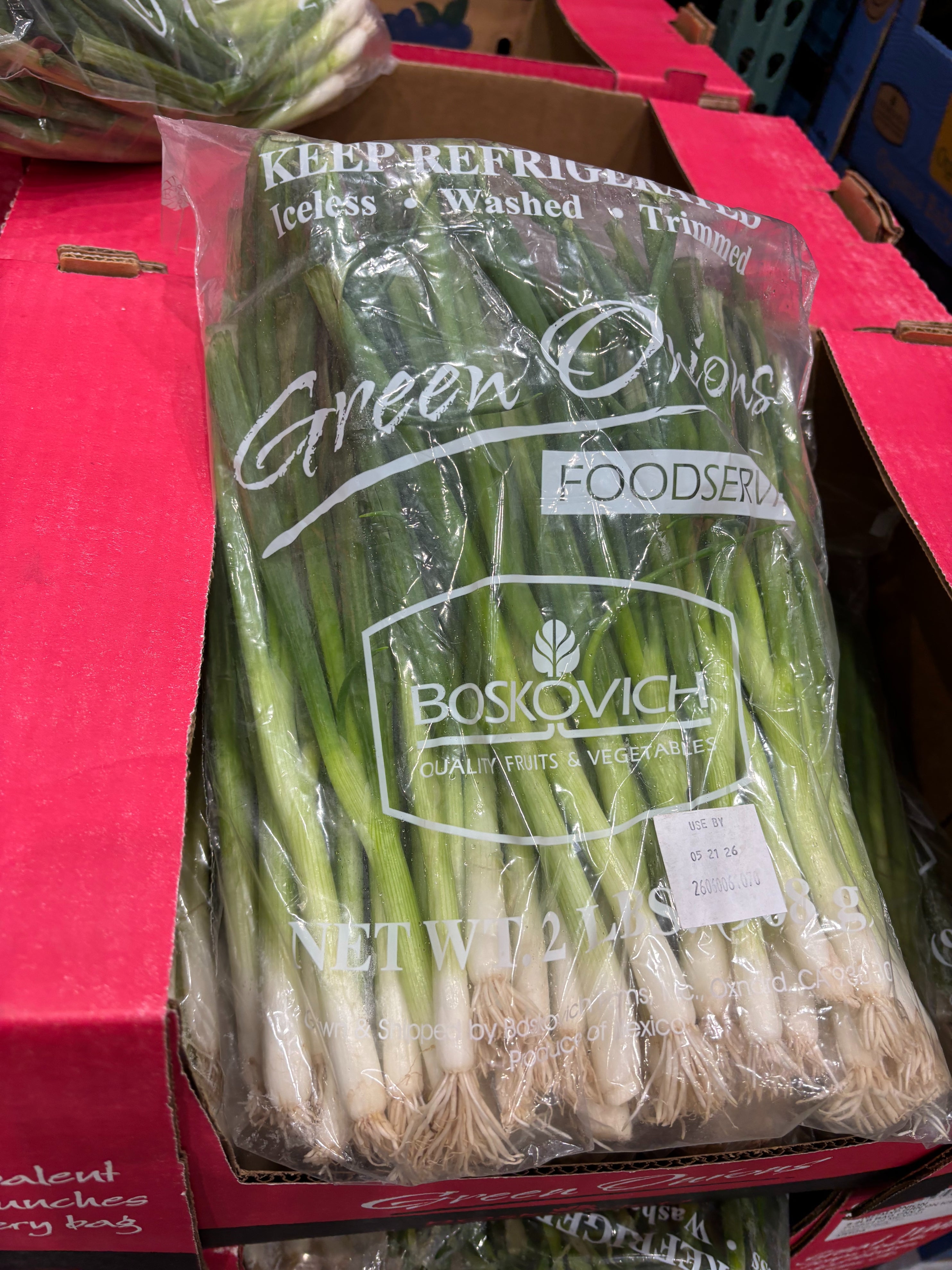 Bag of greenish  onions successful  a supermarket display