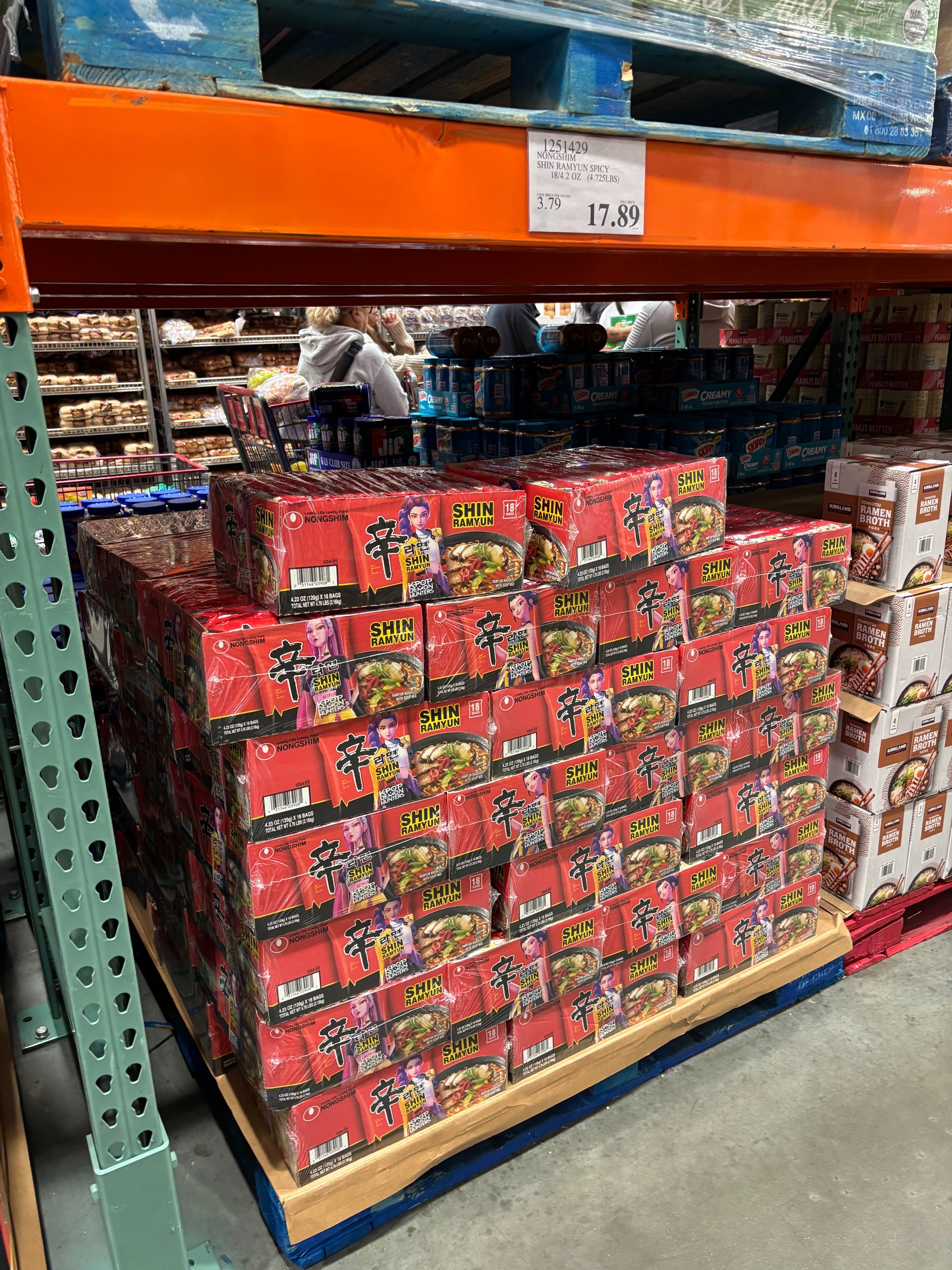 A large stack of Shin Ramyun noodle boxes